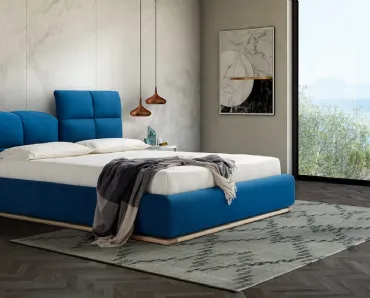 Letto matrimoniale imbottito con testiera sdoppiata che diventa un poggiatesta regolabile e box contenitore Miami di Novaluna
